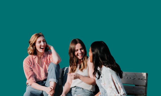 image of girls sitting on bench smiling